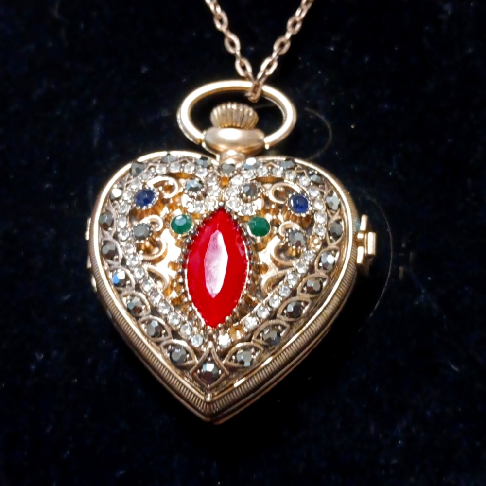 Sarah Coventry bejeweled pocket watch-pendant.
